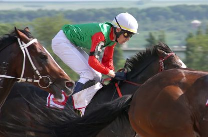 Jockey in Green Silks During Race