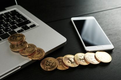 Bitcoin Tokens with Laptop and Smartphone
