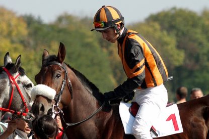 Jockey with Orange Silks on Horse Number 1