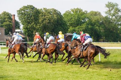 Horses Taking Bend in Summer Race