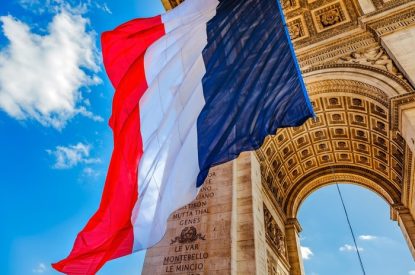 French Flag Beneath Arc de Triomphe