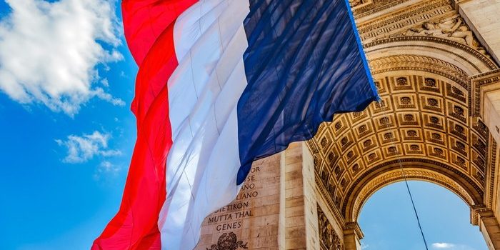 French Flag Beneath Arc de Triomphe