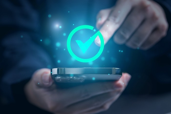 Smartphone with Green Tick Hologram
