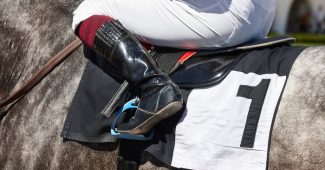Boot of Jockey on Grey Number 1 Horse